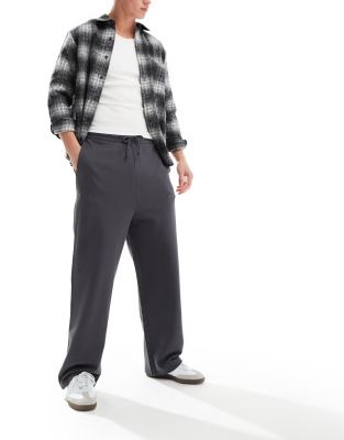 ASOS DESIGN - Effen joggingbroek met wijde pijpen in zwart