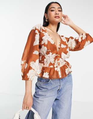 ASOS DESIGN elastic waist blouse with peplum hem & button detail in tonal  floral