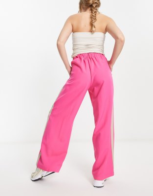 ASOS DESIGN elastic waist side stripe pants in pink with stone stripe