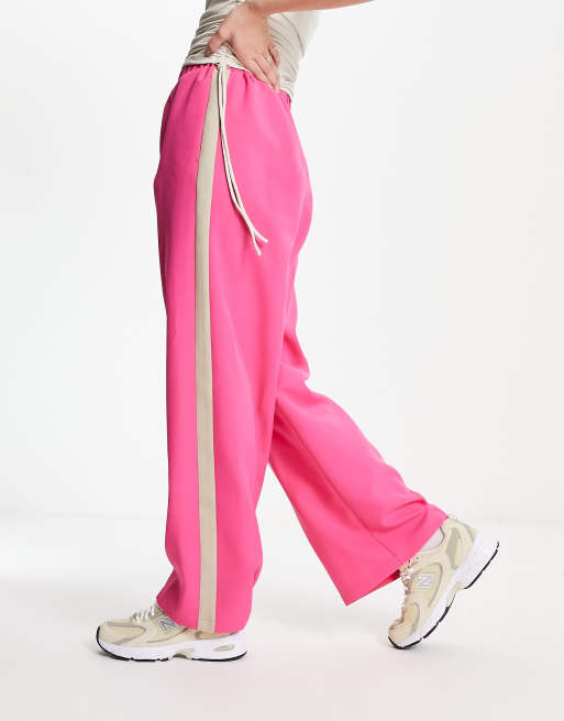 ASOS DESIGN elastic waist side stripe pants in pink with stone