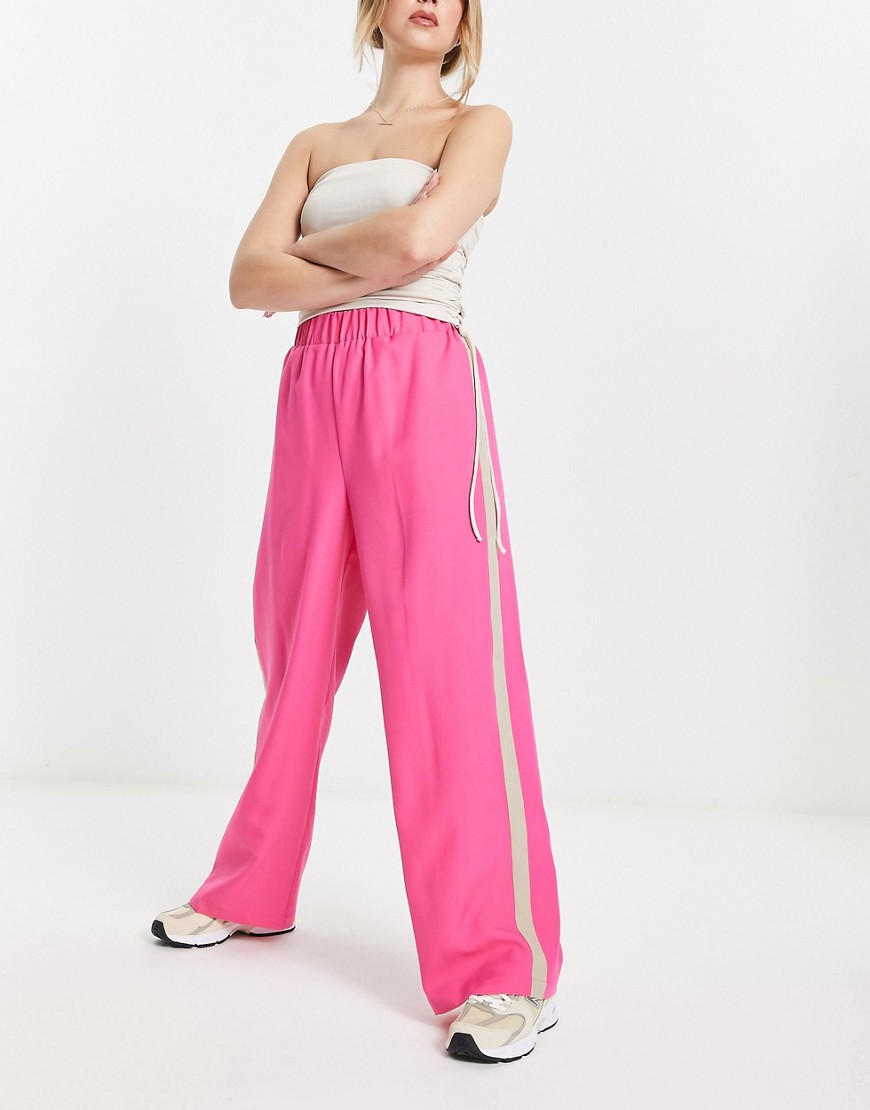 ASOS DESIGN elastic waist side stripe trouser in pink with stone stripe