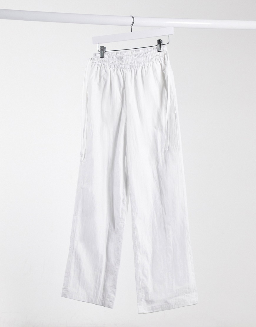 ASOS DESIGN elasticized waist straight leg sweatpants with skinny ties in off white