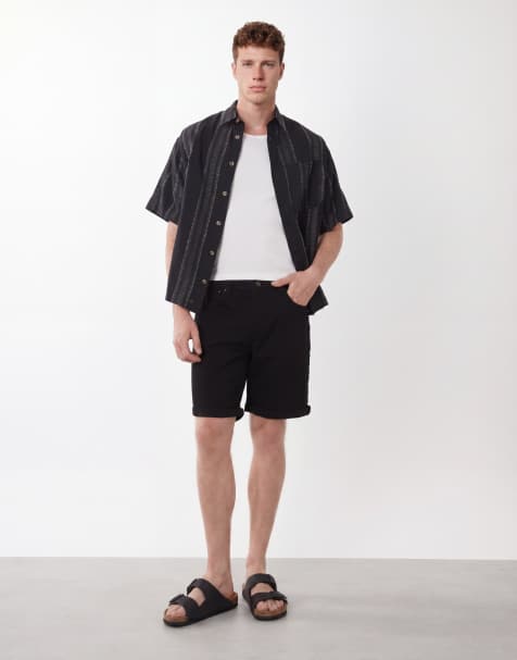 ASOS DESIGN – Elastische Jeans-Shorts in Schwarz in normaler Länge mit schmalem Schnitt - view 1