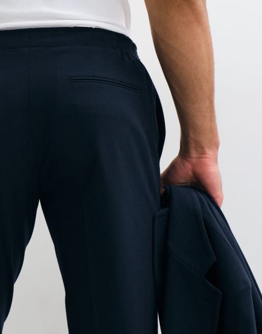 ASOS DESIGN elastyczne spodnie od garnituru slim w granatowym kolorze, 4 z 5