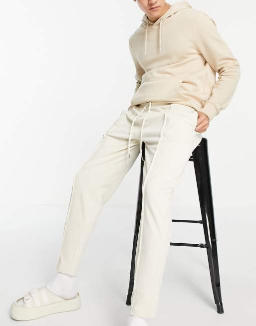 ASOS DESIGN – Eleganckie beżowe joggersy z drobnymi zaszewkami i zawężanymi nogawkami bez ściągaczy