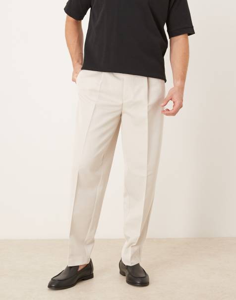 ASOS DESIGN – Eleganckie spodnie o zwężanym kroju oversize z zakładkami z przodu w kolorze ecru - view 1