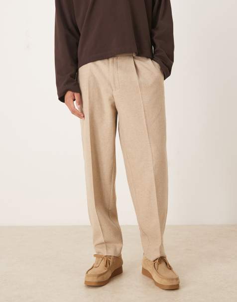 ASOS DESIGN – Eleganckie spodnie oversize o zwężanym kroju z zakładkami z mieszanki wełny w kolorze kamiennobeżowym - view 1