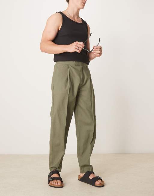 ASOS DESIGN – Eleganckie zwężane spodnie oversize z zakładkami z przodu z mieszanki lnu w kolorze zgaszonej oliwki