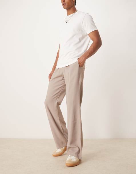 ASOS DESIGN – Elegante, ausgestellte Hose mit weitem Bein und Bundfalten in Beige - view 1