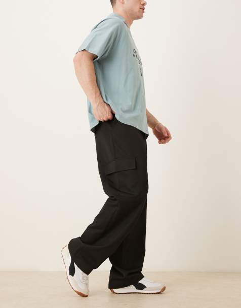 ASOS DESIGN – Elegante Cargo-Hose in Schwarz mit weitem Bein und elastischem Bund - view 1