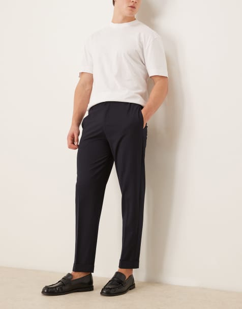 ASOS DESIGN – Elegante, schmal zulaufende Chinohose in Marineblau mit Mikrostruktur und elastischem Bund - view 1