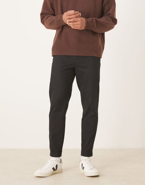 ASOS DESIGN – Elegante, schmal zulaufende Hose aus 100% Baumwolle in Schwarz mit Umschlag - view 1