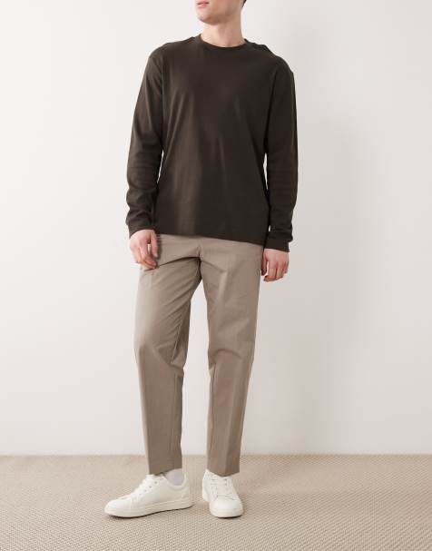 ASOS DESIGN – Elegante, schmal zulaufende Hose aus Paper-Touch-Tech-Material in Khaki mit lockerem Schnitt - view 1