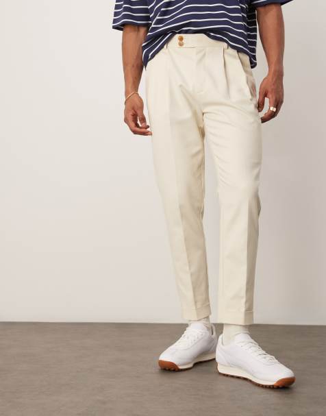 ASOS DESIGN – Elegante, schmal zulaufende Hose in Beige mit sichtbaren Knöpfen - view 1