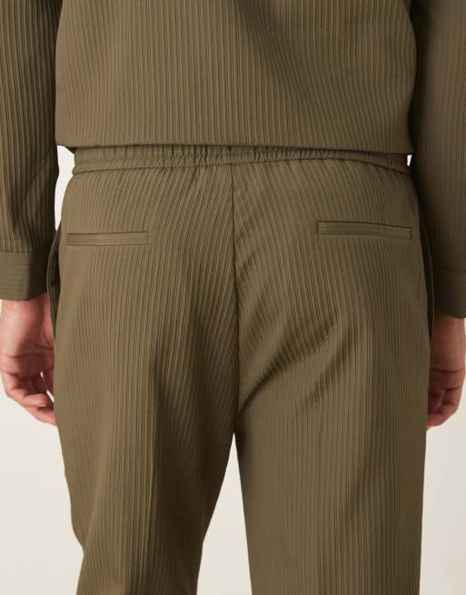 ASOS DESIGN – Elegante, schmal zulaufende Hose in Khaki mit Rippenstruktur und elastischem Bund, Kombiteil, 4 von 5