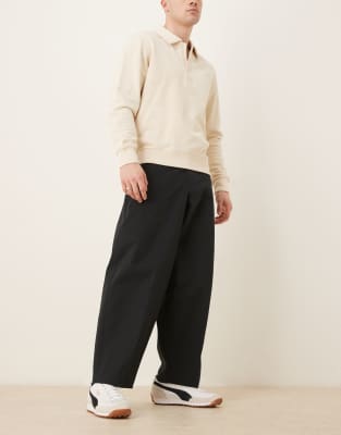 ASOS DESIGN – Elegante, schmal zulaufende Hose in Schwarz mit sehr weitem Schnitt - view 1