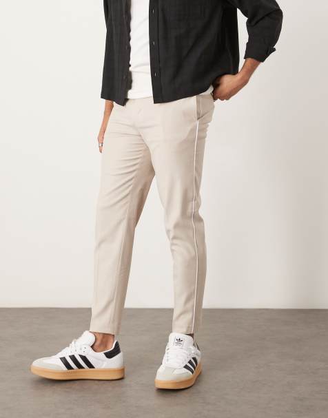 ASOS DESIGN – Elegante, schmal zulaufende Hose in Steinbeige mit seitlicher Paspelierung - view 1