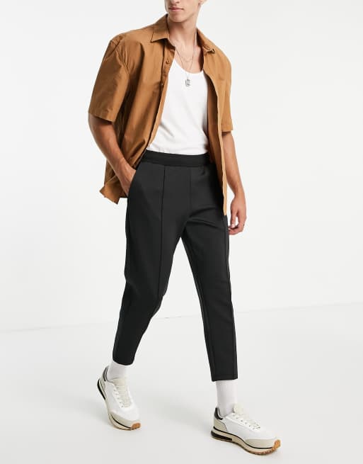 ASOS DESIGN – Elegante, schmal zulaufende Jogginghose aus Neopren mit festem Saum und Biesen in Schwarz