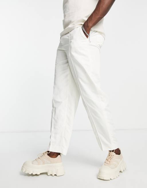 ASOS DESIGN – Elegante, schmal zulaufende Oversize-Hose in Ecru mit ausgestelltem Reißverschluss