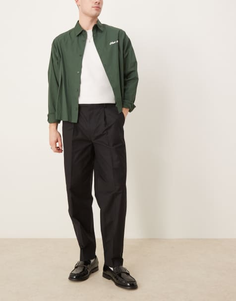 ASOS DESIGN – Elegante, schmal zulaufende Oversize-Hose in Schwarz mit angerauter Struktur und doppelte Bundfalten - view 1