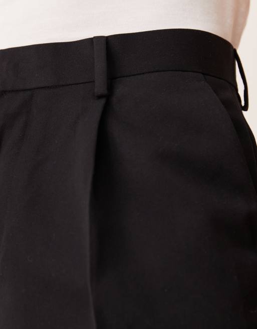 ASOS DESIGN – Elegante, schmal zulaufende Oversize-Hose in Schwarz mit Bundfalten, 4 von 5