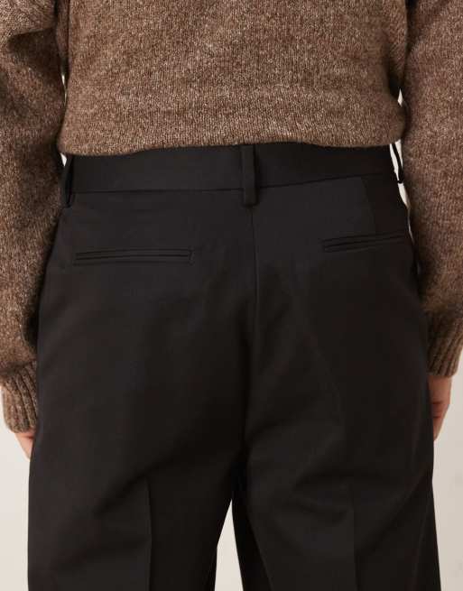ASOS DESIGN – Elegante, schmal zulaufende Oversize-Hose in Schwarz mit Doppel-Bundfalten, 4 von 5