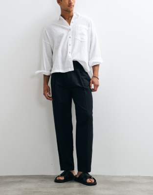 Elegante, schmal zulaufende Oversize-Hose in Schwarz mit hohem Leinenanteil Schwarz 50 Long