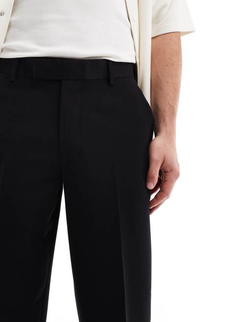 ASOS DESIGN – Elegante, schmal zulaufende Oversize-Hose in Schwarz, 4 von 5