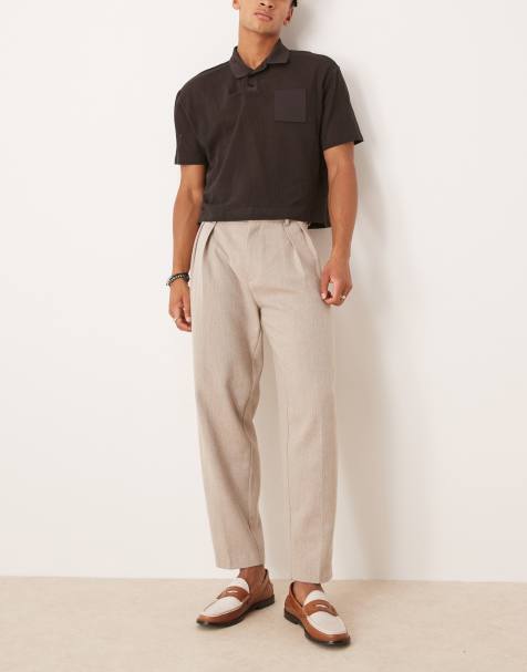 ASOS DESIGN – Elegante, schmal zulaufende Oversize-Hose mit Wollanteil in Kamelbraun mit Fischgrätmuster und Bundfalten - view 1