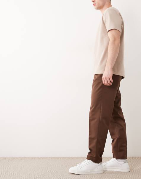 ASOS DESIGN – Elegante, schmal zulaufende Schlupfhose in Dunkelbraun - view 1