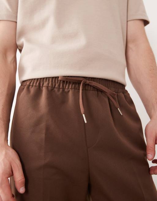 ASOS DESIGN – Elegante, schmal zulaufende Schlupfhose in Dunkelbraun, 2 von 5