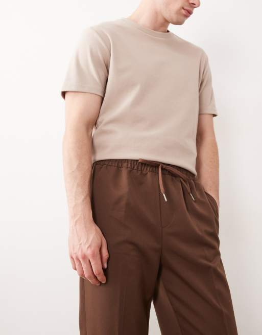 ASOS DESIGN – Elegante, schmal zulaufende Schlupfhose in Dunkelbraun, 5 von 5