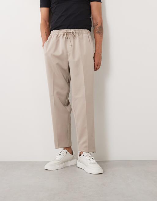 ASOS DESIGN – Elegante, schmal zulaufende Schlupfhose in Steinbeige, 4 von 5
