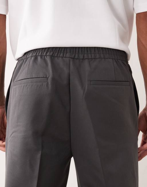 ASOS DESIGN - Elegante toelopende broek met elastische taille in antracietgrijs, 4 van 5