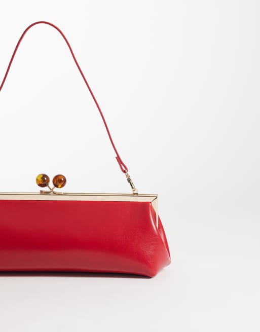 ASOS DESIGN elongated frame clutch bag with shoulder strap in red, 4 of 4