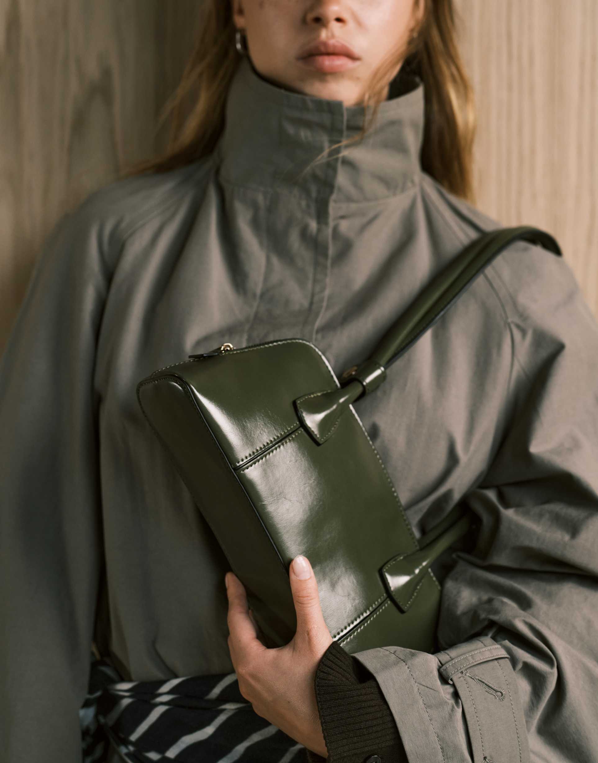 asos design elongated handle curved base bowler bag with seam details in olive