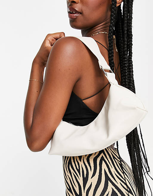 ASOS DESIGN elongated shoulder bag with wide strap in off white