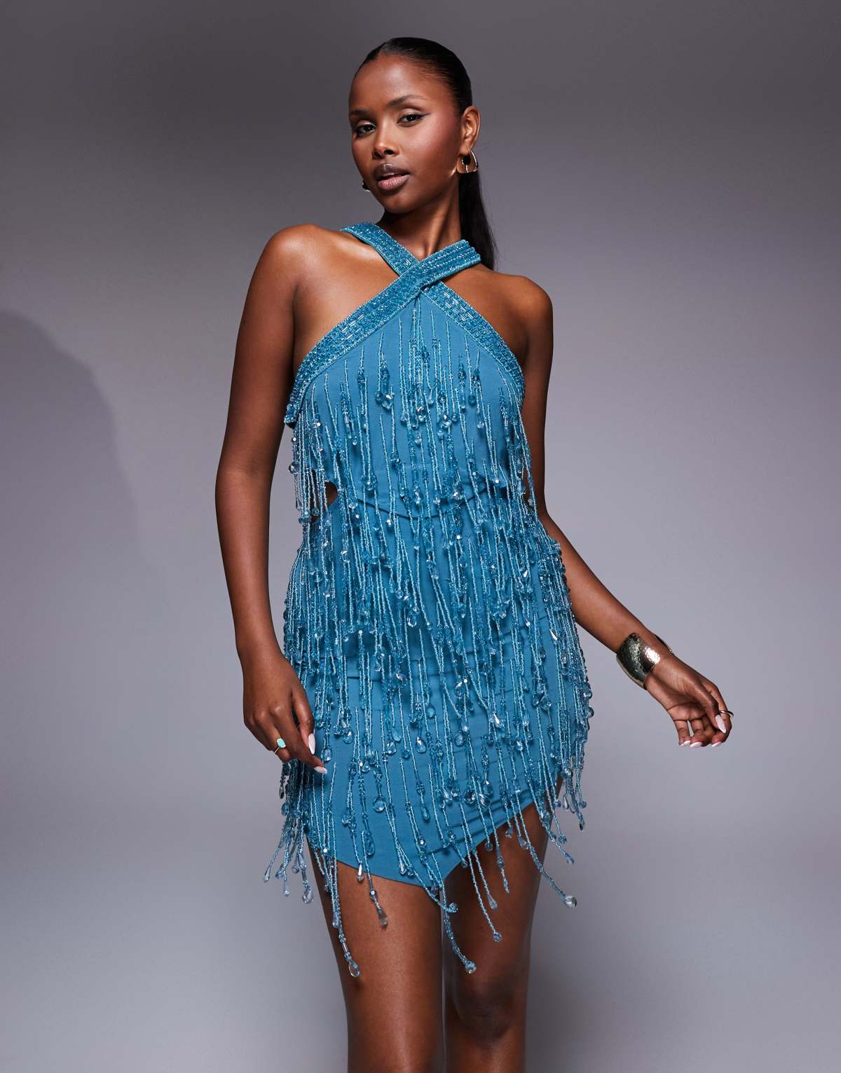 ASOS DESIGN embellished halter mini dress with cutout waist and pointed hem in blue