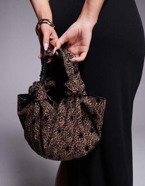 ASOS DESIGN embellished slouchy clutch bag with knot handles in leopard print - view 1