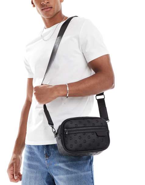ASOS DESIGN embossed faux leather crossbody bag in black - view 1