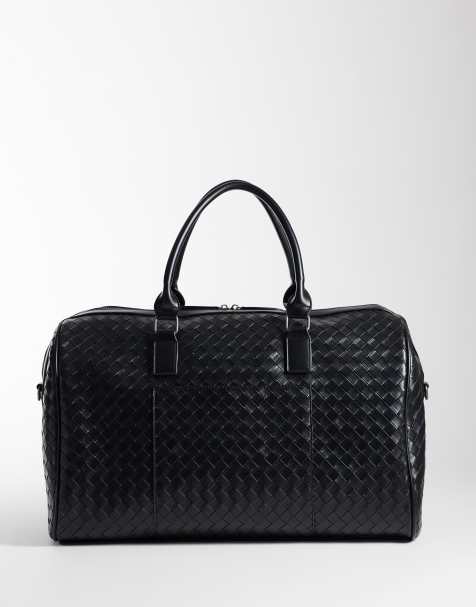 ASOS DESIGN embossed weave holdall bag in black - view 1