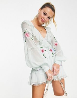 ASOS DESIGN embriodered dobby cut out playsuit with ruffle wrap in pale blue - ASOS Price Checker