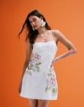 [ASOS DESIGN] ASOS DESIGN embroidered cami mini dress with ruffle floral detail in white 16 White