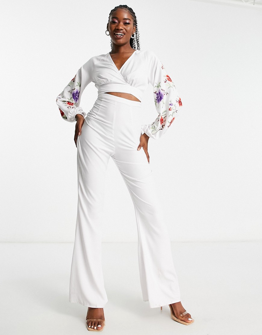 ASOS DESIGN embroidered cut out jumpsuit with flare leg in white