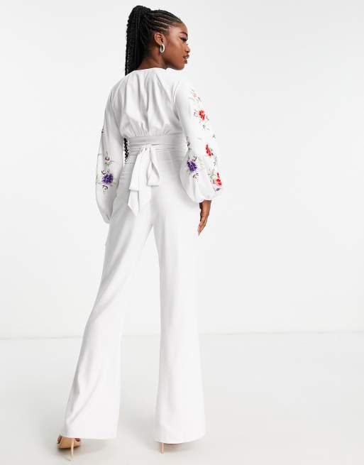 ASOS DESIGN embroidered cut out jumpsuit with flare leg in white