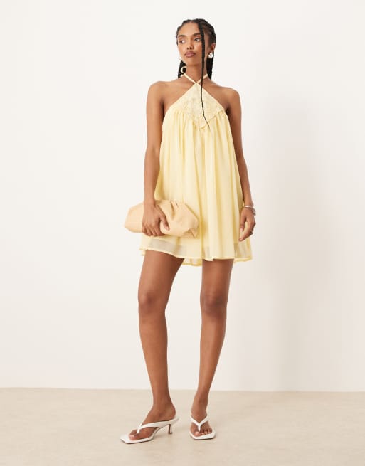 ASOS Design embroidered halter neck mini puff dress in lemon-Orange