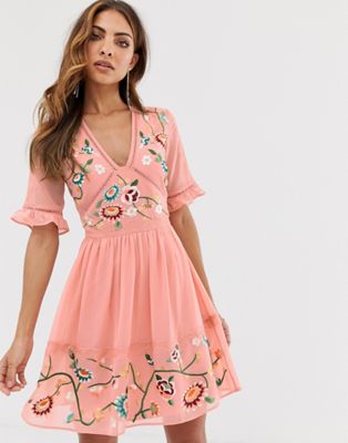 ASOS DESIGN embroidered mini dress with lace trims in Pink