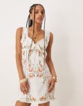 [ASOS DESIGN] ASOS DESIGN embroidered mini dress with tie bust in white 8 White