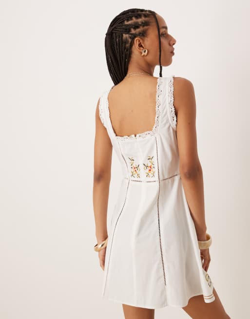 ASOS DESIGN embroidered mini dress with tie bust in white