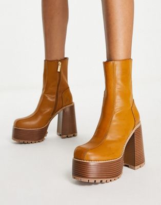  Emotive high-heeled platform ankle boots in tan